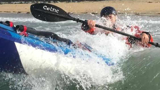 Kayak Breaking Through Surf Anglesey